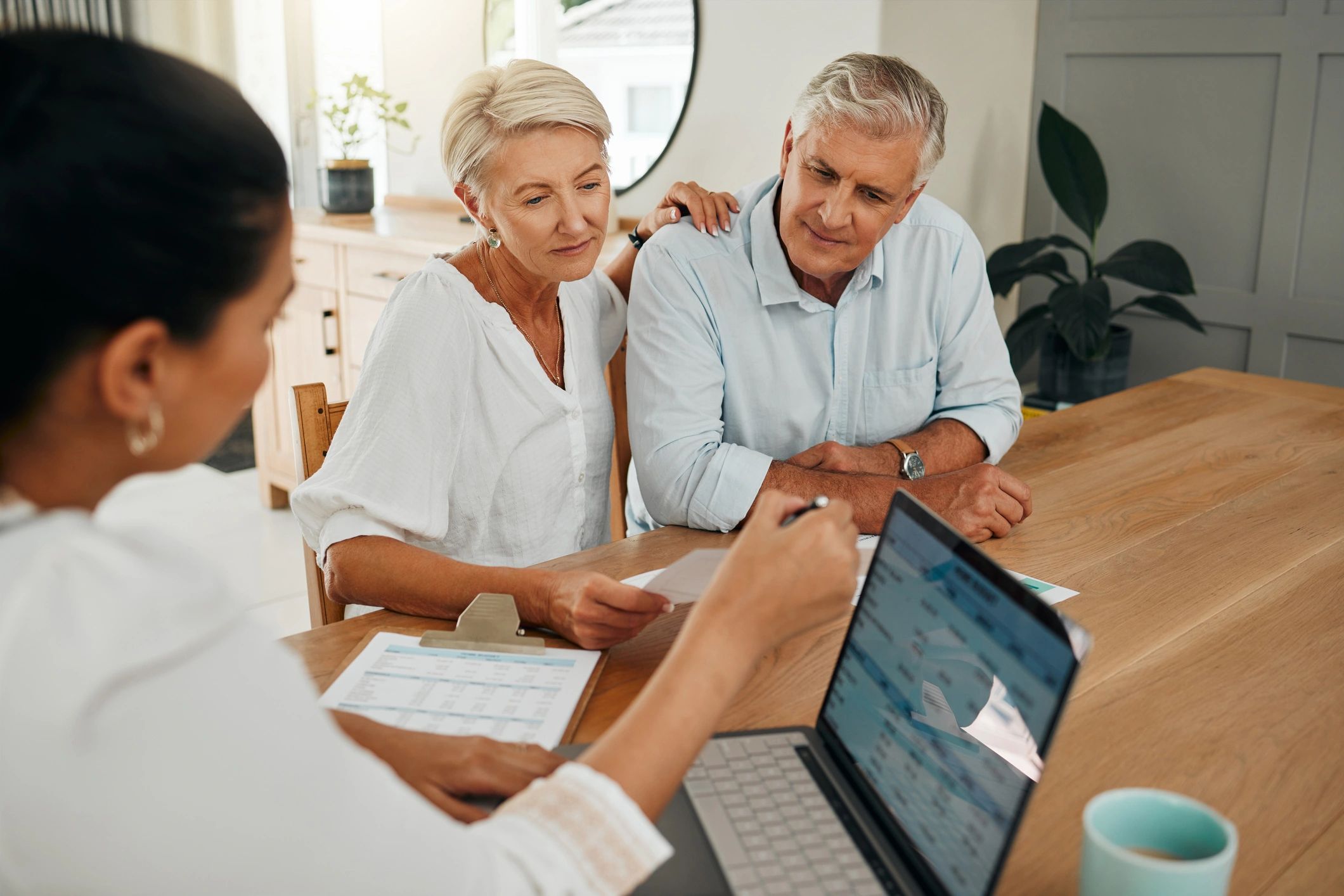 Retired couple reviewing Social Security planning documents